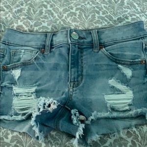 America eagle shorts with rips.